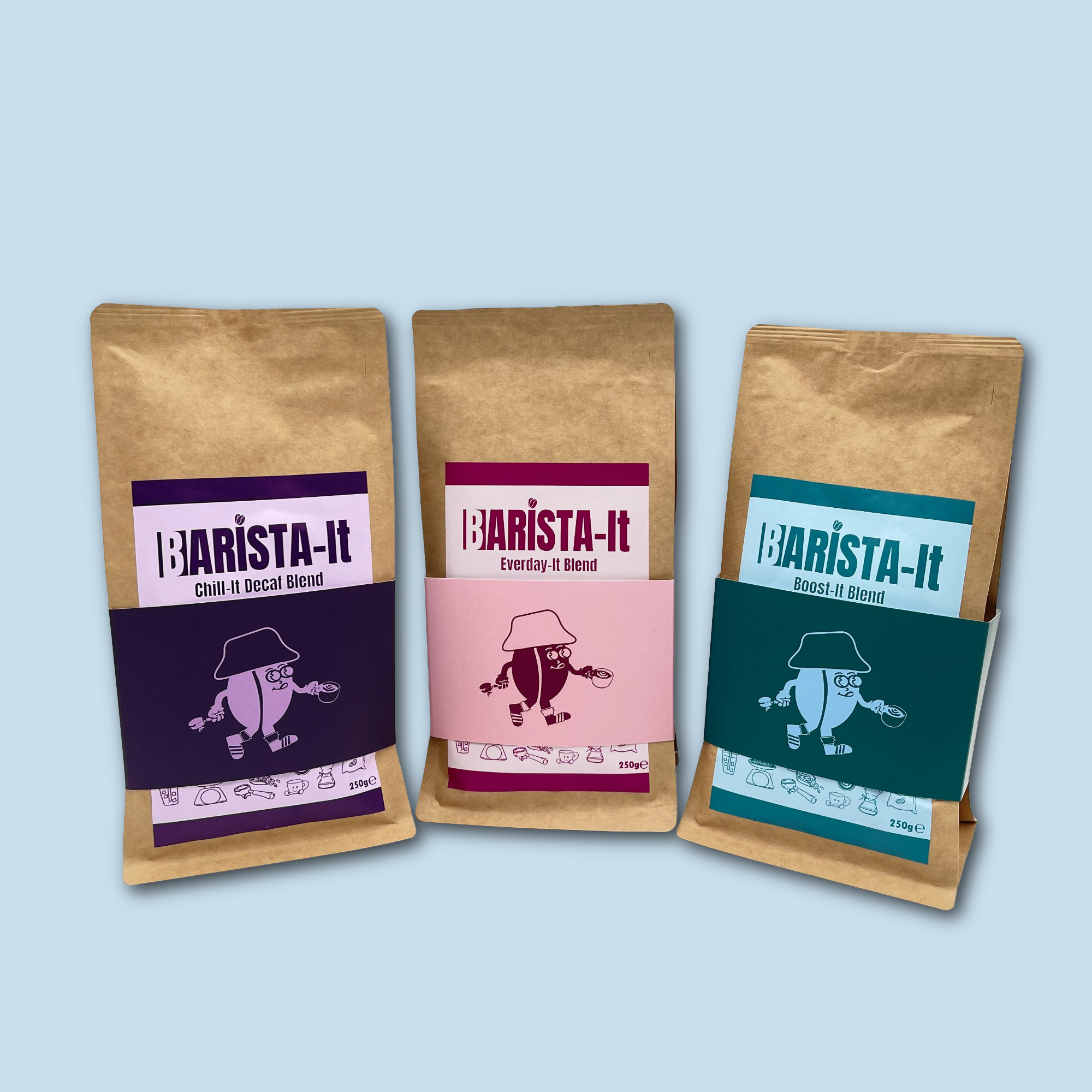 Three 'Barista-It' coffee bags with different designs on a light blue background