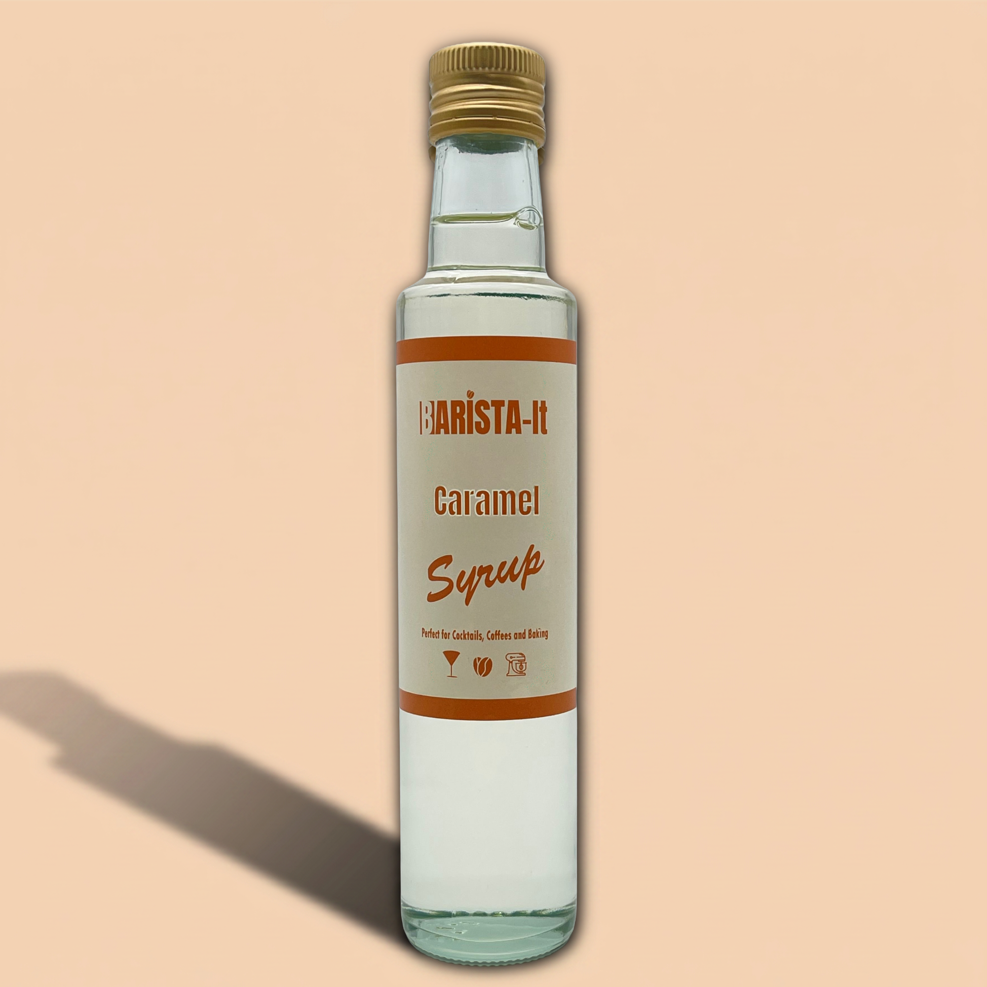 Bottle of Barista-It Caramel Syrup on a beige background
