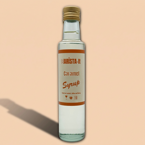 Bottle of Barista-It Caramel Syrup on a beige background