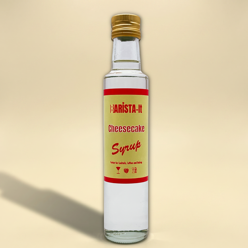 Bottle of Barista-it Cheesecake Syrup on a yellow background.