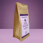 Barista-It Kraft brown paper bag with a purple label on a purple background (Chill-It Blend)