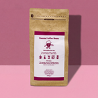 Barista-It Kraft paper coffee bean bag with a pink label on a pink background (Everyday-It blend)