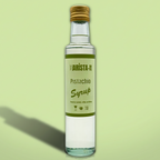 Bottle of Barista-It Pistachio Syrup on a light green background