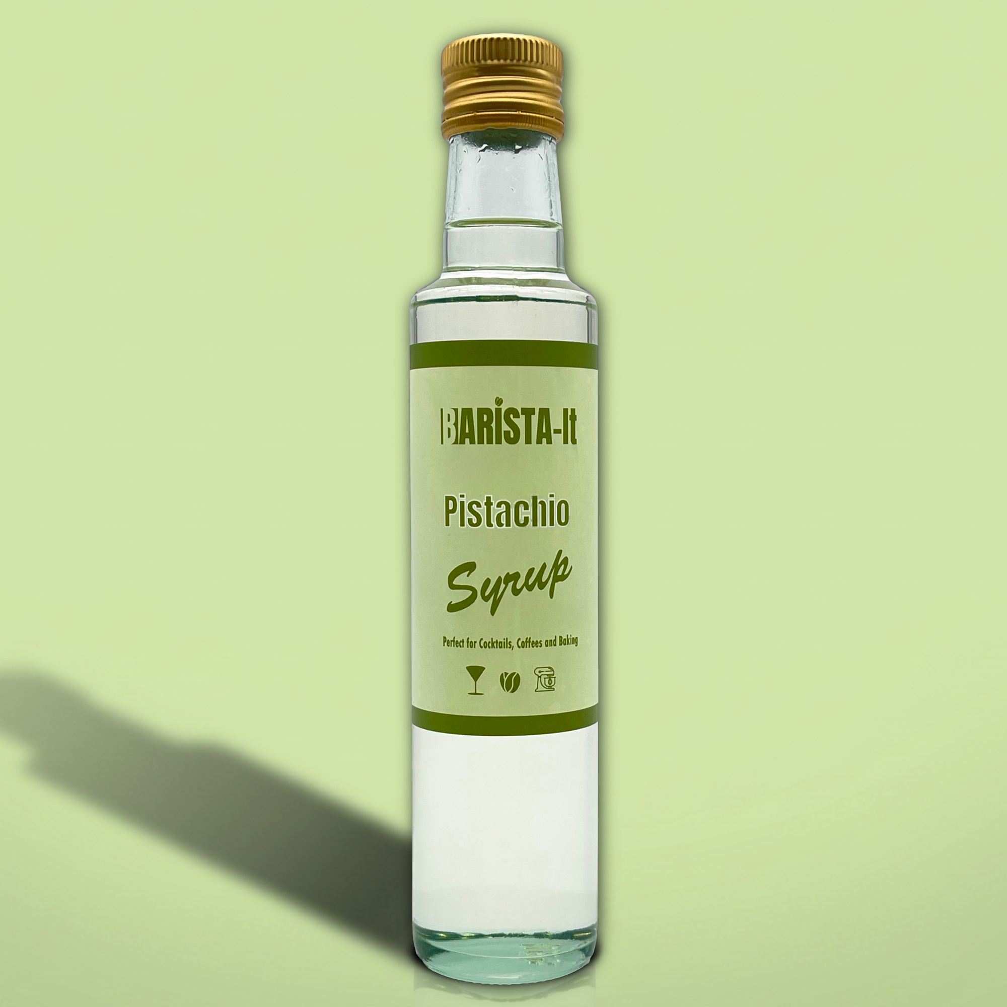 Bottle of Barista-It Pistachio Syrup on a light green background